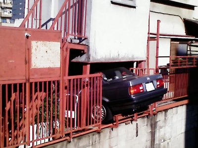 Car parked adventurously in Tokyo, Japan