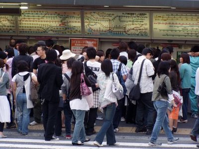 Crowds buying tickets at Harajuku Station, Tokyo.